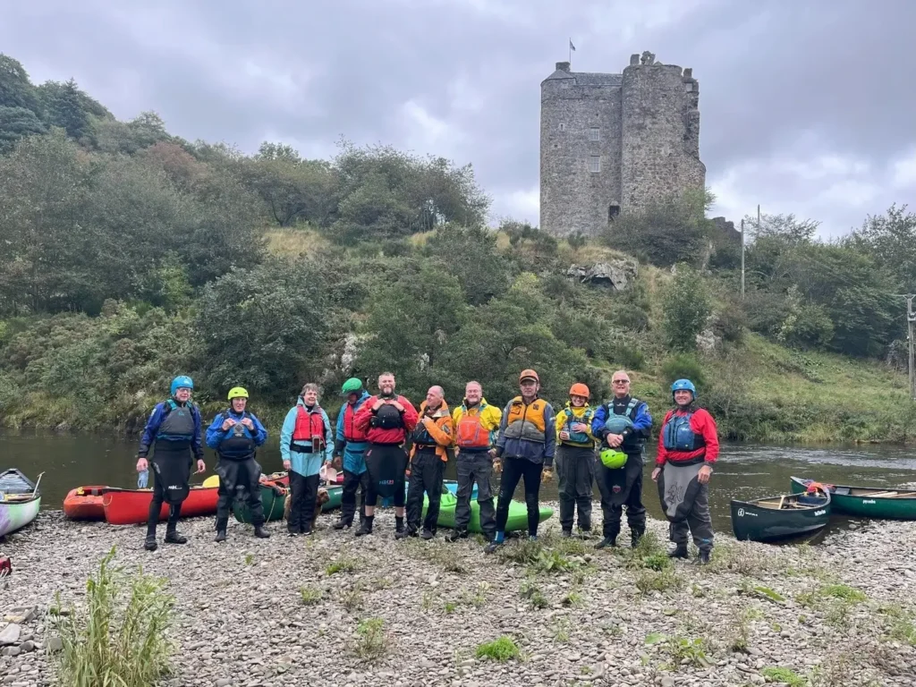 Paddlers have a break near Neidpath Castle